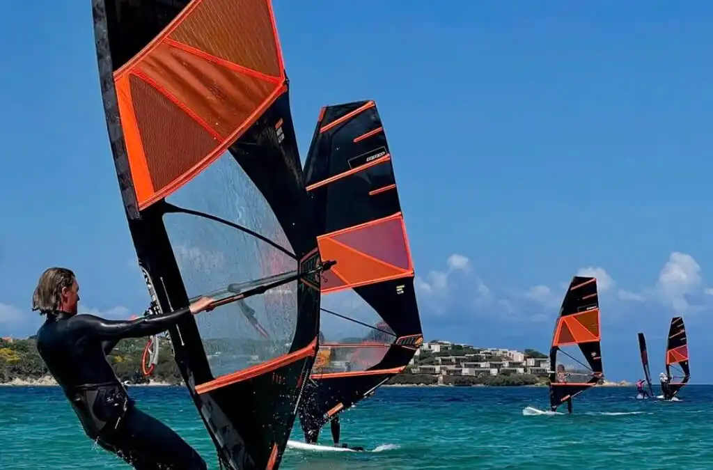 A group of windsurfers in Sardinia at Porto Pollo